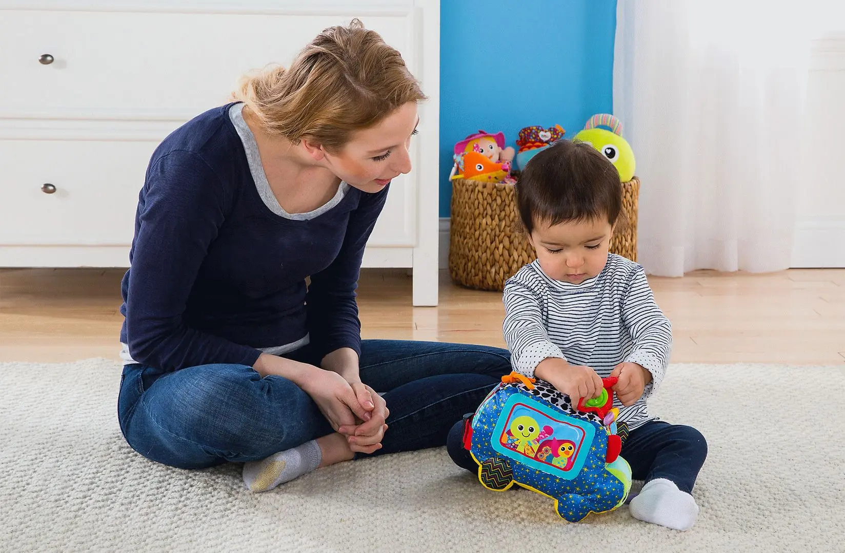 Jucarie moale educativa Lamaze Freddie Bus (Multicolor)