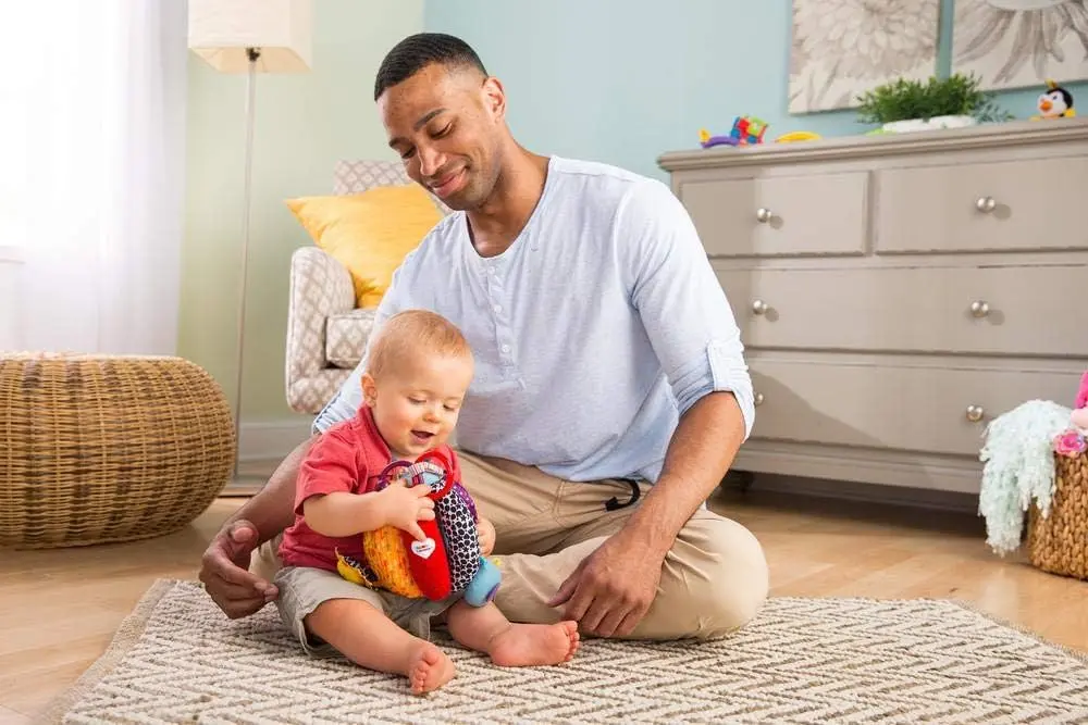 Jucarie moale educativa Lamaze Grab And Hide Ball (Multicolor)